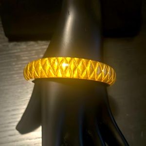 Lightweight gold harlequin, styled bracelet.